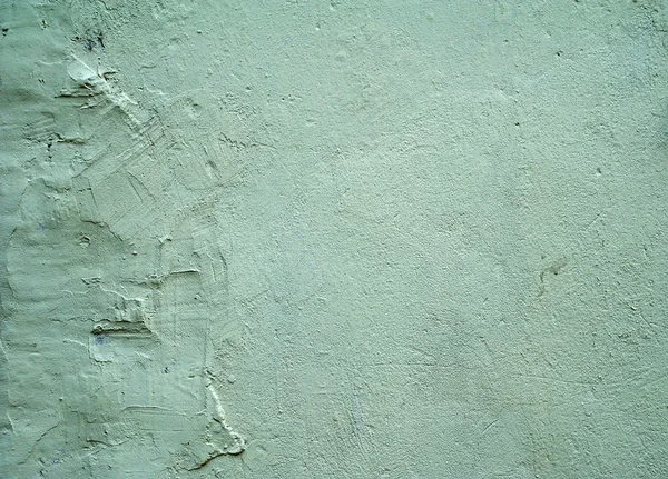 Textura de parede velha coberta com estuque verde — Fotografia de Stock
