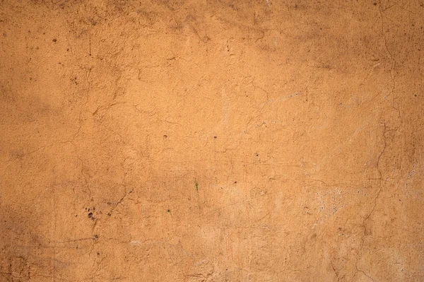 Textura de pared vieja cubierta con estuco amarillo — Foto de Stock