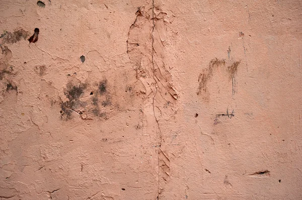 Textura de pared vieja cubierta con estuco rosa — Foto de Stock