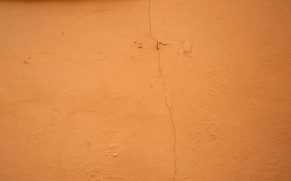 Textura de pared vieja cubierta con estuco amarillo —  Fotos de Stock