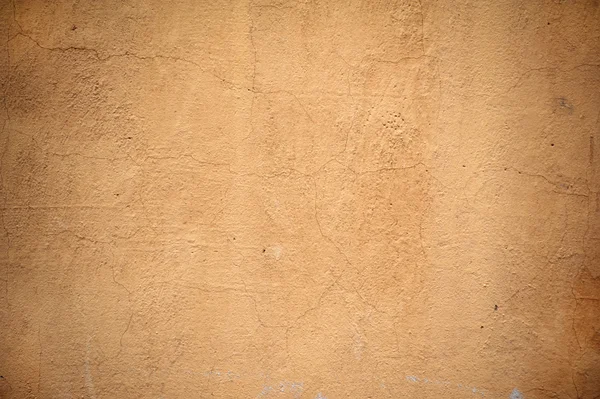 Texture della vecchia parete ricoperta di stucco giallo — Foto Stock