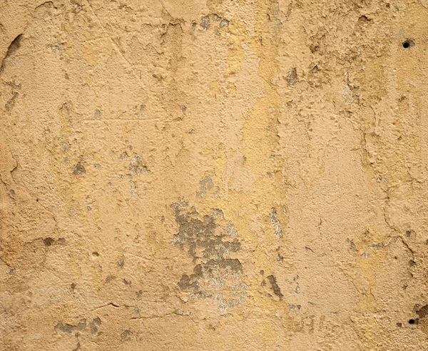 Textura de pared vieja cubierta con estuco amarillo — Foto de Stock