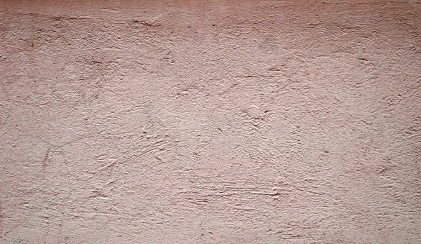 Textura de pared vieja cubierta con estuco rosa — Foto de Stock