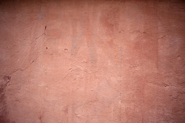 Textura de pared vieja cubierta con estuco rosa — Foto de Stock