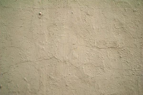 Textura de pared vieja cubierta con estuco amarillo — Foto de Stock