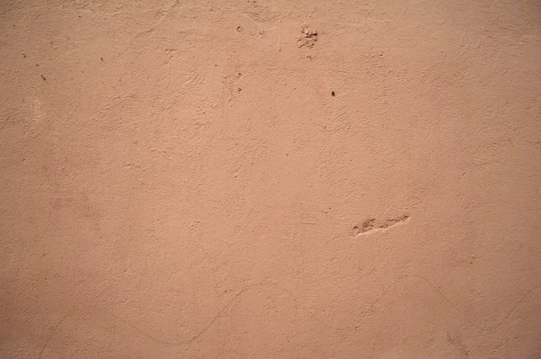 Textura de pared vieja cubierta con estuco rosa — Foto de Stock