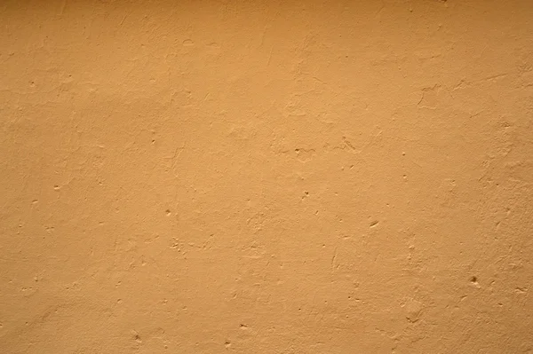 Textura de pared vieja cubierta con estuco amarillo — Foto de Stock