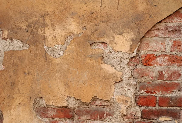 Texture of old wall covered with yellow stucco — Stock Photo, Image