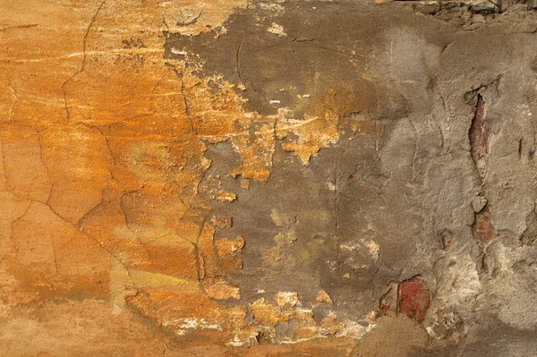 Textur der alten Mauer mit gelbem Stuck überzogen — Stockfoto