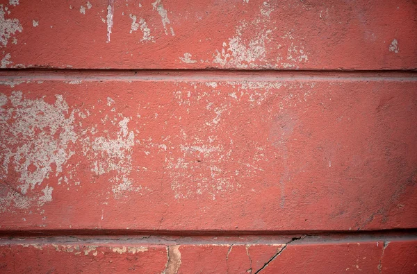 Textur der alten Mauer mit rotem Stuck überzogen — Stockfoto