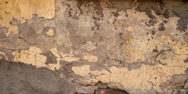 Texture of old wall covered with yellow stucco — Stock Photo, Image