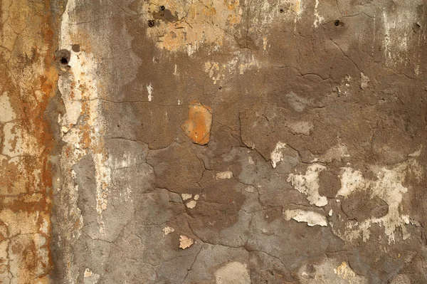 Textuur van oude muur bedekt met gele stucwerk — Stockfoto