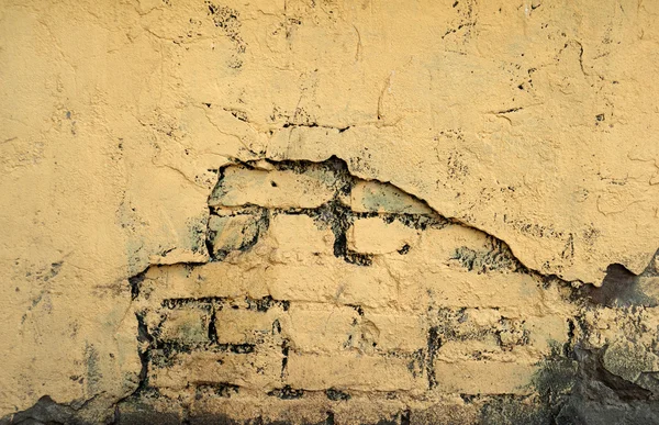 Texture of old wall covered with yellow stucco — Stock Photo, Image