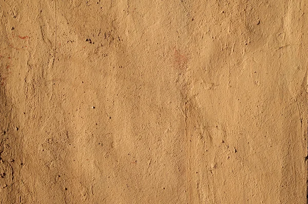 Texture di vecchia parete ricoperta di stucco marrone — Foto Stock