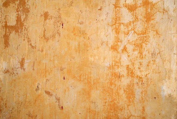 Textura de pared vieja cubierta con estuco amarillo — Foto de Stock