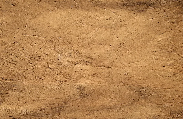 Texture de vieux mur recouvert de stuc jaune — Photo