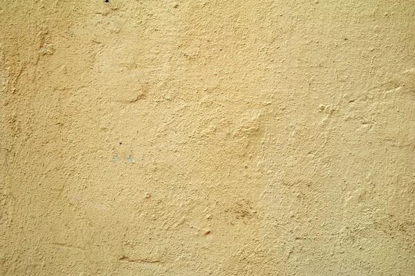 Textura de pared vieja cubierta con estuco amarillo — Foto de Stock