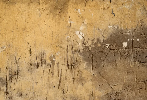 Textur der alten Mauer mit gelbem Stuck überzogen — Stockfoto