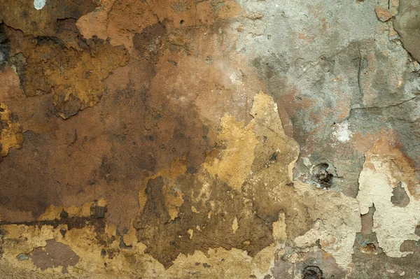 Textur der alten Mauer mit gelbem Stuck überzogen — Stockfoto