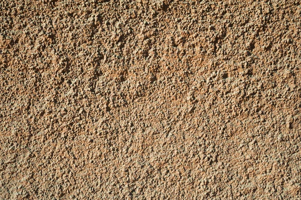 Tekstur af gamle væg dækket med brune stuk - Stock-foto