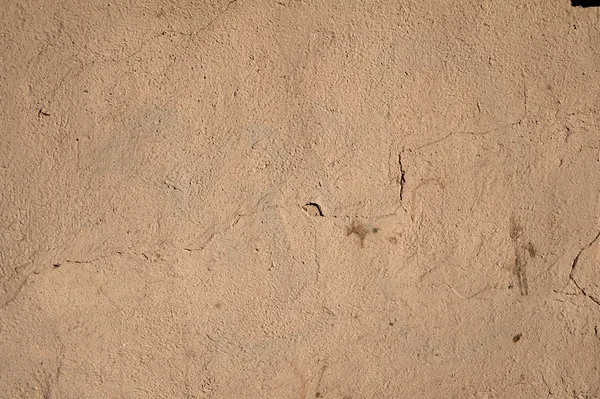 Textur der alten Mauer mit braunem Stuck überzogen — Stockfoto