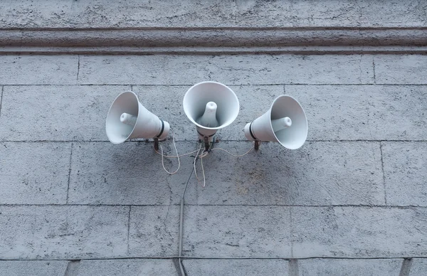 Three loudspeakers on building — Stock Photo, Image