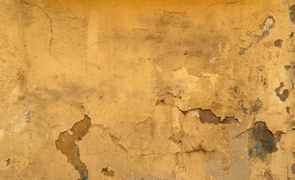 Textura de pared vieja cubierta con estuco amarillo —  Fotos de Stock