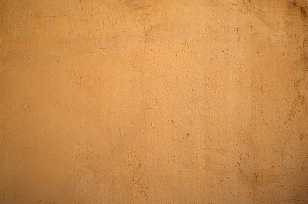 Textura de pared vieja cubierta con estuco amarillo — Foto de Stock