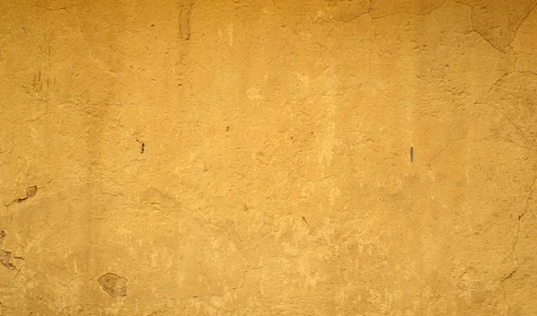 Textura de pared vieja cubierta con estuco amarillo — Foto de Stock