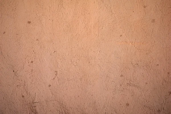 Textur der alten Mauer mit rosa Stuck verkleidet — Stockfoto