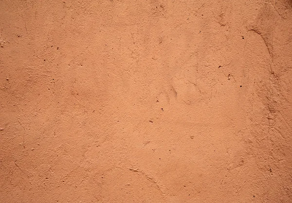 Texture de vieux mur recouvert de stuc rose — Photo
