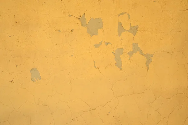 Textura de pared vieja cubierta con estuco amarillo — Foto de Stock