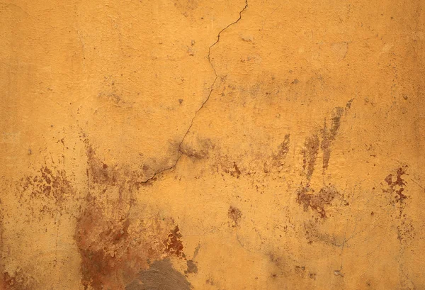 Texture of old wall covered with yellow stucco — Stock Photo, Image