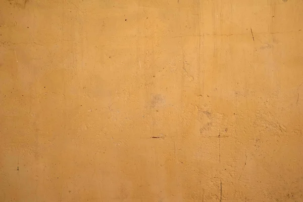 Textura de pared vieja cubierta con estuco amarillo — Foto de Stock