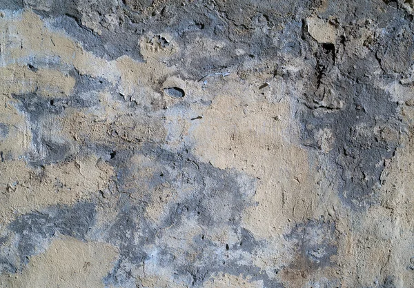 Textur der alten Mauer mit gelbem Stuck überzogen — Stockfoto