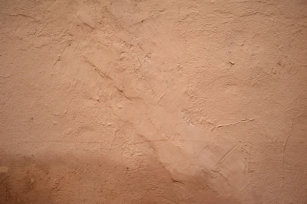 Textura de pared vieja cubierta con estuco rosa — Foto de Stock