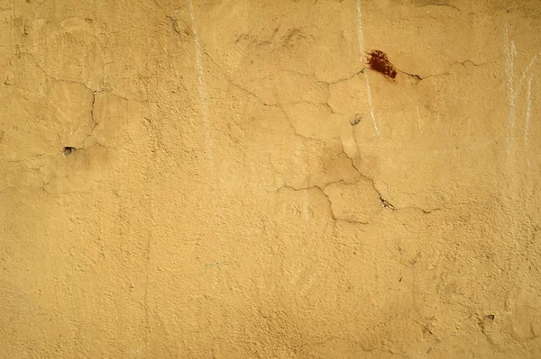 Textura de pared vieja cubierta con estuco amarillo — Foto de Stock