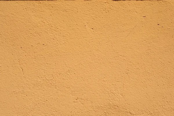 Textura de pared vieja cubierta con estuco amarillo — Foto de Stock