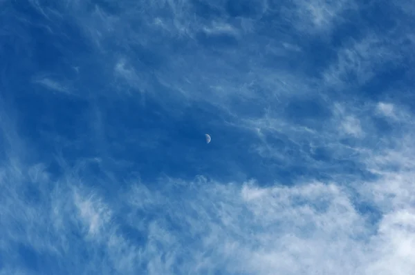 Texture of blue sky clouds and new moon — Stock Photo, Image