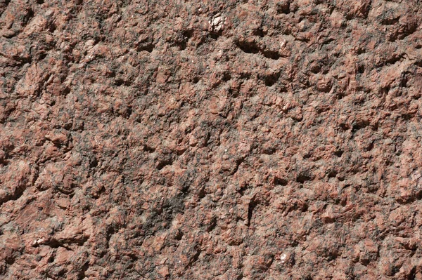 Textur der Wand aus poliertem rosa Granit — Stockfoto