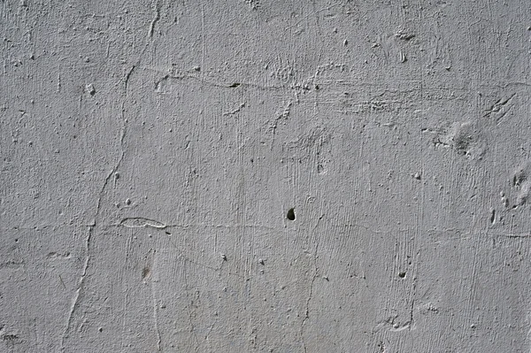 Textura de pared vieja cubierta con estuco gris — Foto de Stock