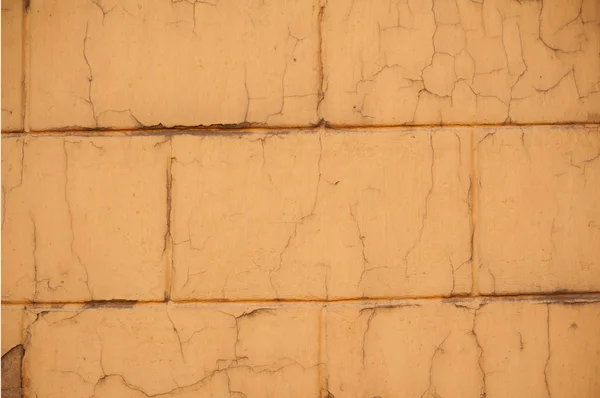 Texture della vecchia parete ricoperta di stucco giallo — Foto Stock