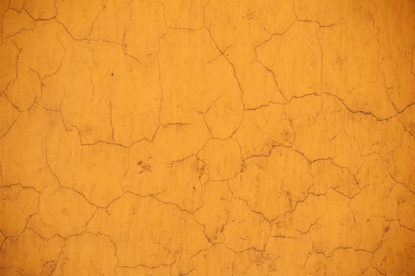 Texture della vecchia parete ricoperta di stucco giallo — Foto Stock