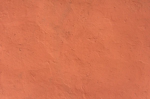 Textura de pared vieja cubierta con estuco rojo — Foto de Stock