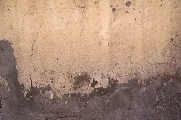 Textur der alten Mauer mit gelbem Stuck überzogen — Stockfoto