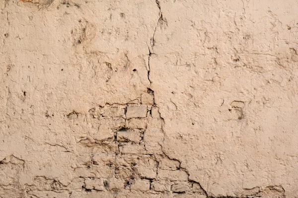 Textuur van oude muur bedekt met gele stucwerk — Stockfoto