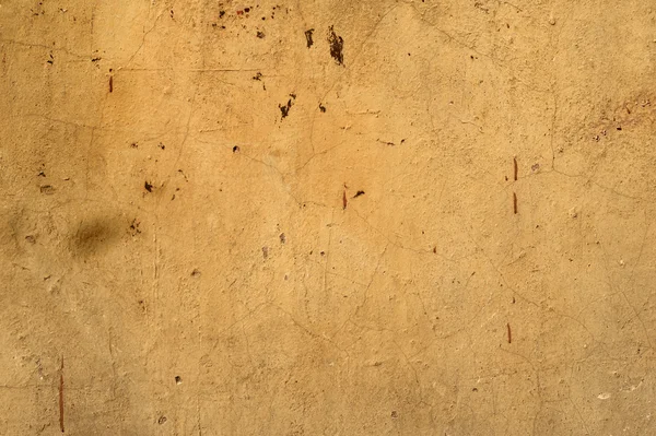 Textura de pared vieja cubierta con estuco amarillo — Foto de Stock