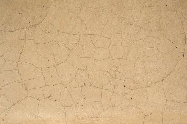 Texture della vecchia parete ricoperta di stucco giallo — Foto Stock