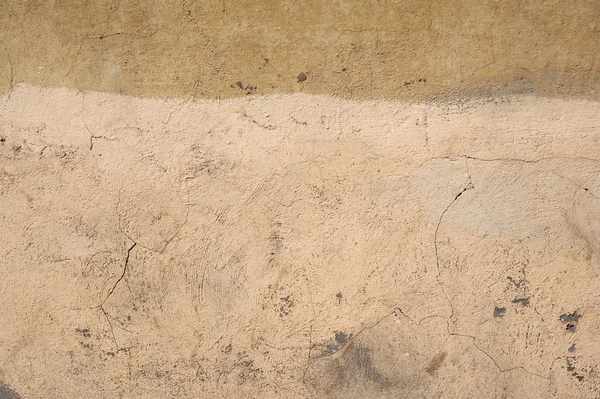 Textura de pared vieja cubierta con estuco amarillo — Foto de Stock