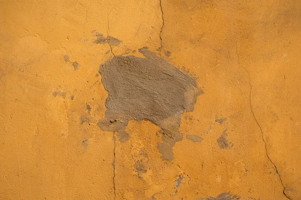 Texture of old wall covered with yellow stucco — Stock Photo, Image